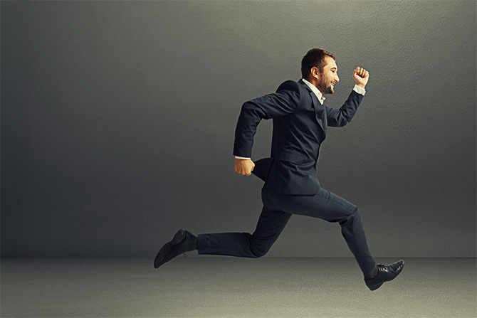 Man in suit running
