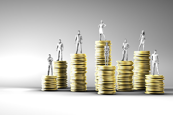 Small silver statuettes of professionals standing on top of gold coin stacks