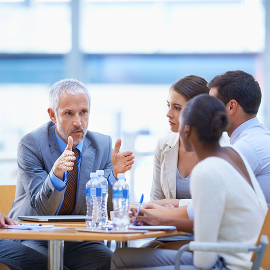 people at a table having a discussion
