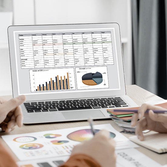 Computer with graphs and charts on screen